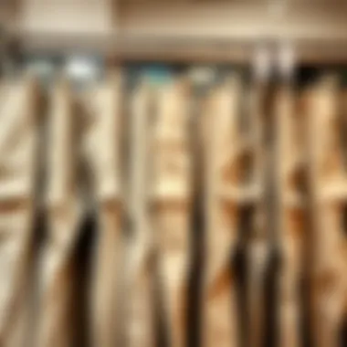 Different designs of beige cargo pants displayed on a rack