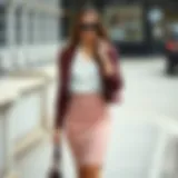 Elegant combination of a fitted mini skirt with a stylish blouse and accessories.