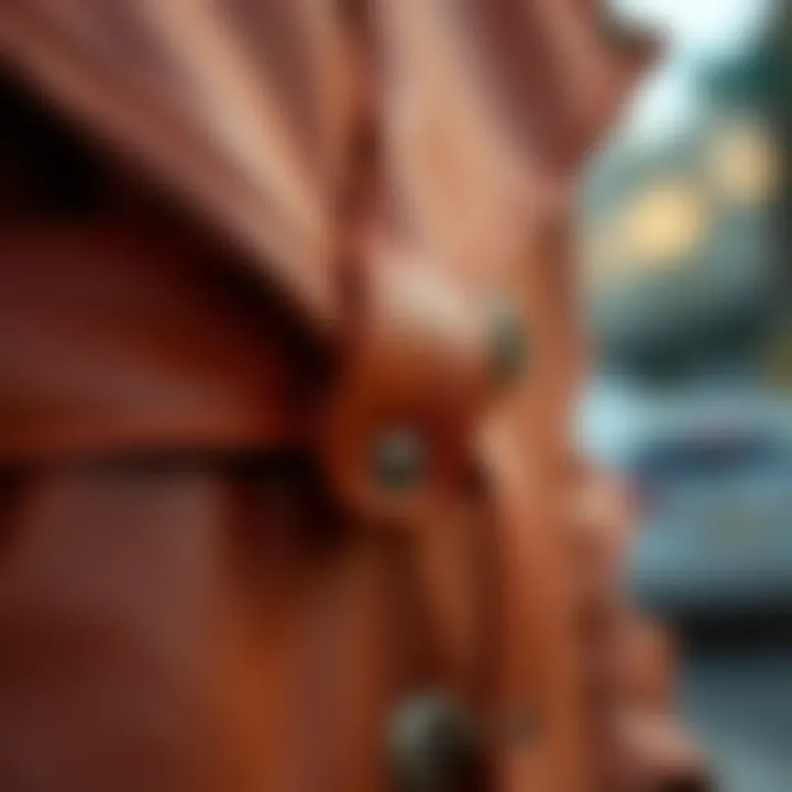 Close-up of leather detailing on a trench coat.