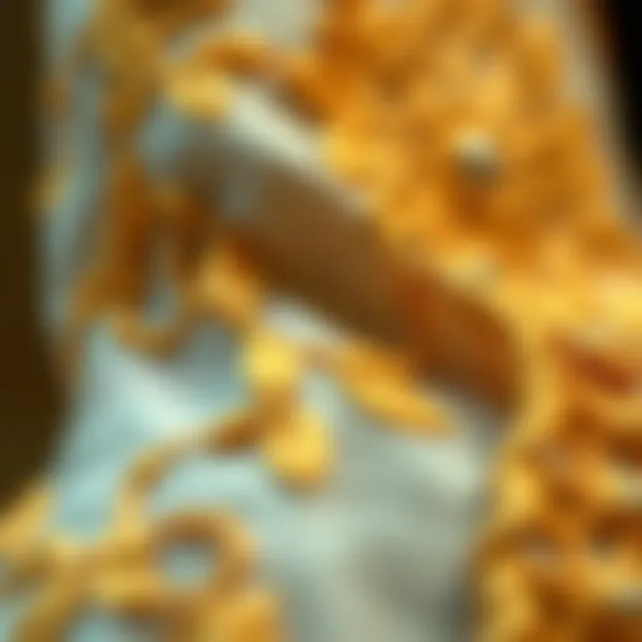 Artistry in Gold: Embroidery Details Detailed embroidery showcasing gold threads