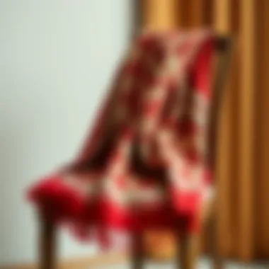 Elegant G patterned scarf draped on a chair