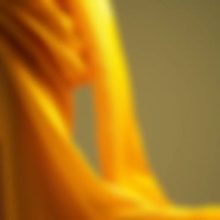 Elegance of Golden Tones in Fashion Golden hue fabric draping elegantly