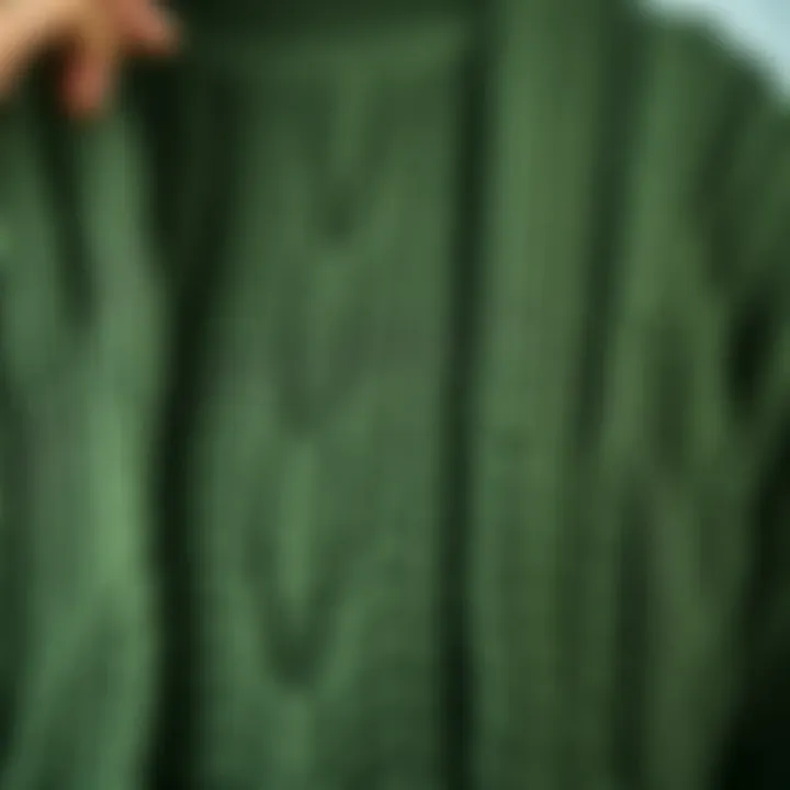 Close-up of a green cardigan highlighting its intricate knit pattern