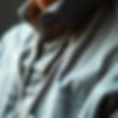 A close-up of unique details and stitching on a gray shirt