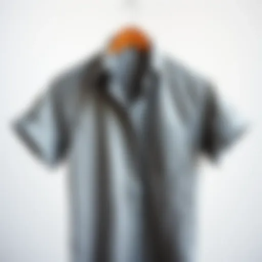 A stylish gray shirt draped elegantly on a minimalist backdrop