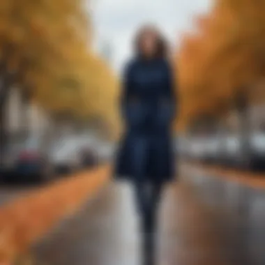 Seasonal transition outfit showcasing a navy trench coat in a fall setting