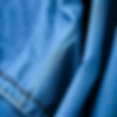 A close-up of the fabric texture of a blue denim jacket