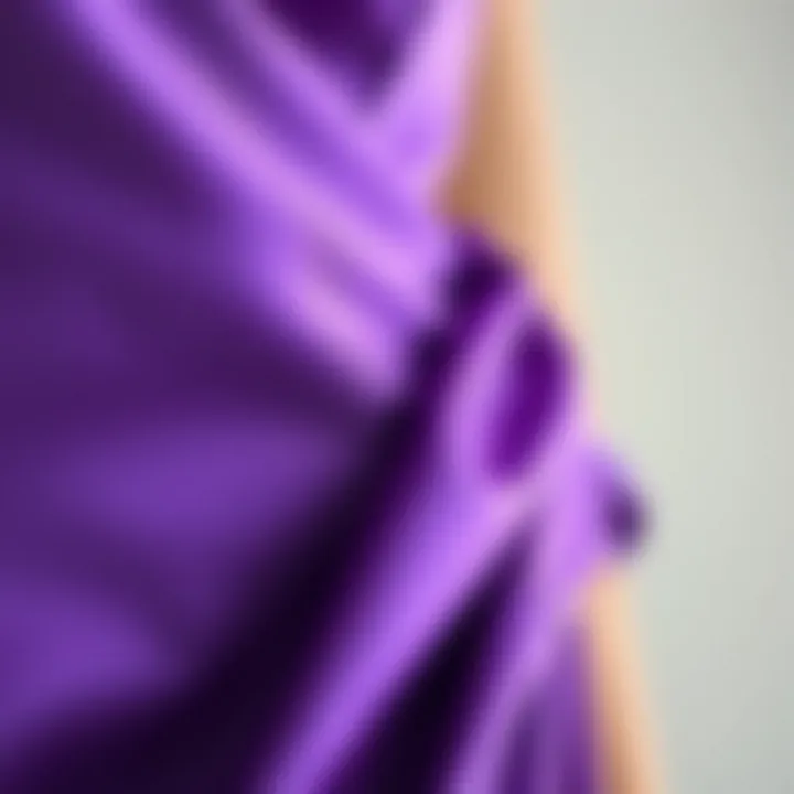 Detailed view of fabric and color of a purple satin dress