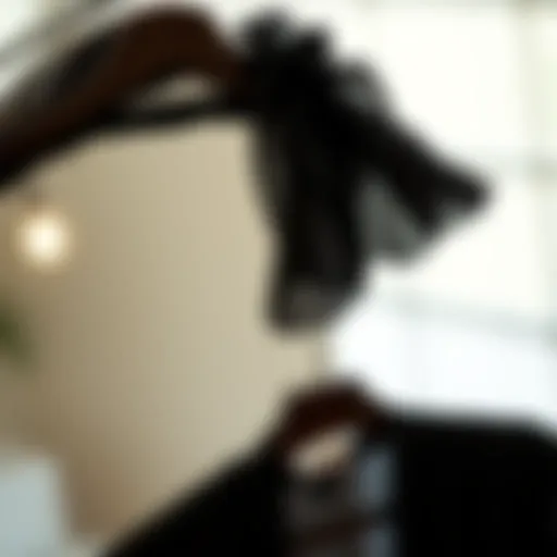 Elegant black chiffon blouse on a stylish hanger