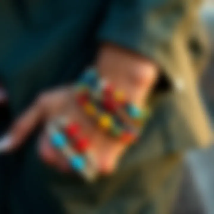 A stylish individual layering multiple colorful bead bracelets