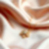 Elegant clover chain necklace showcased on a silk background